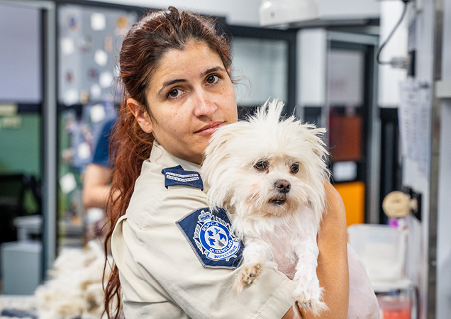 RSPCA Inspector with white dog.